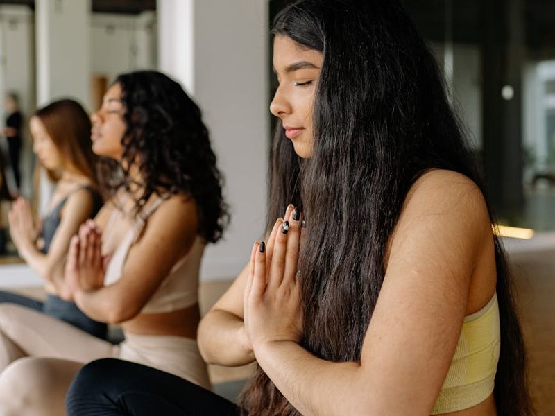 Close up of hands in a yoga mudra position