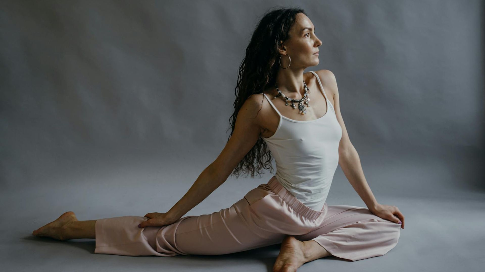 Person practicing peaceful yoga in a bright studio
